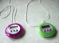 Portable pendant timer alerts, made from regular kitchen timers, drilled with holes and threaded with cord
